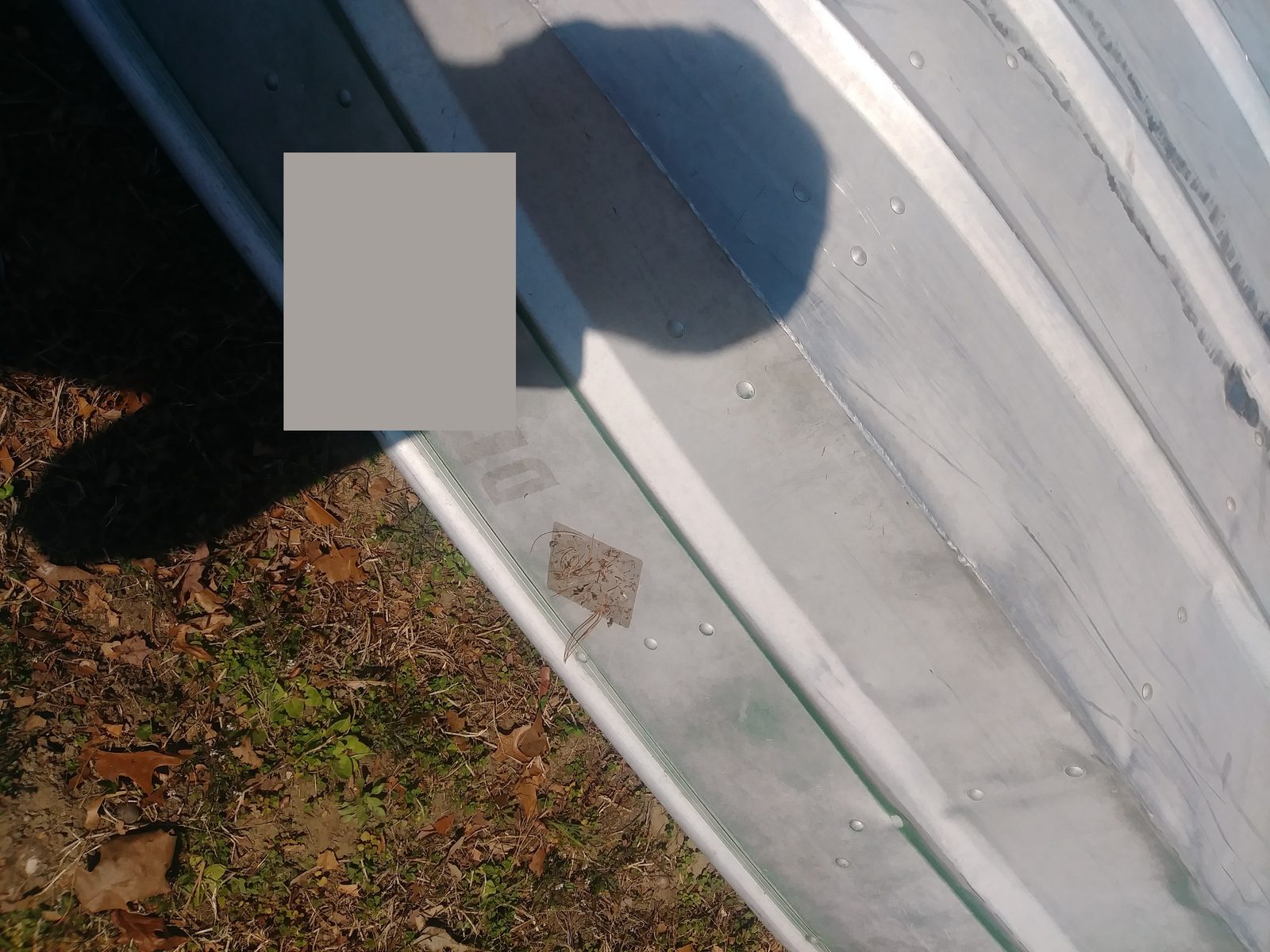 Close-up of the rubberized rub rail along the hull edge
